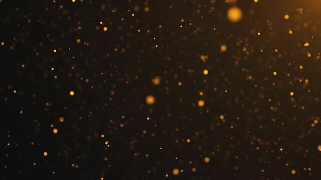 Golden particles float gently in footage of a dark space environment