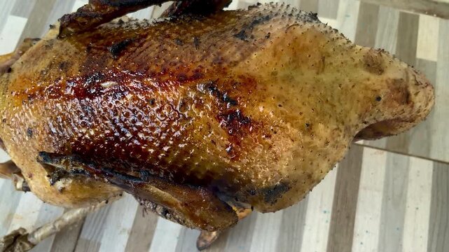 Close up of roasted Muscovy duck with crispy glistening skin