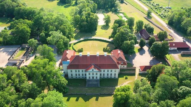 Aerial 4K video from a drone to Suuremoisa baroque manor ensemble in Estonia.  Hiiumaa, Estonia, baltic.