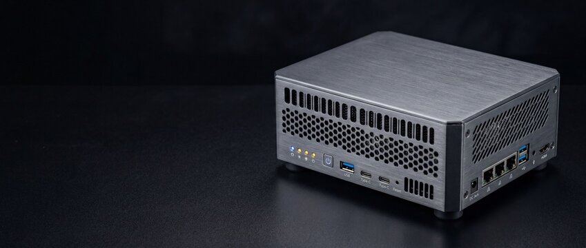 Industrial Edge Computing Mini PC with Brushed Aluminum Case Featuring USB-C HDMI and LAN Ports on Black Background