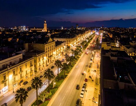 Illuminated cityscape of Lecce, Italy at night from above.