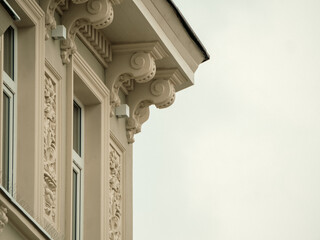 Elegant stone corbels support a gable's decorative roofline © Dennis