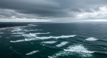 Fototapeta premium Expansive Ocean Waves Under Gloomy Sky with Stormy Clouds Approaching the Coastline and Rippled Water Surface