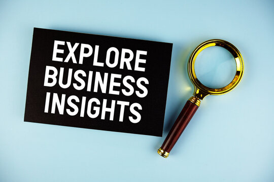Explore Business Insights text with Magnifying glass on blue background