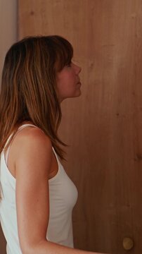 Woman Choosing An Outfit From Her Closet At Home