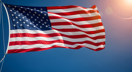 Obraz premium American flag waving in the wind with sunlight