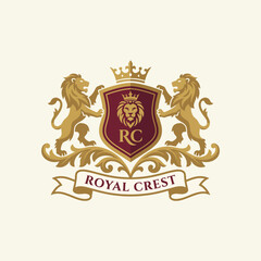 An elegant logo portraying a royal crest with lions and a crown, evoking concepts of nobility, strength, and heritage for luxury brands and services. © uki