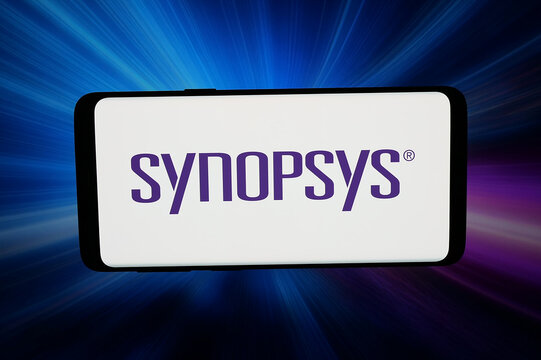 Stuttgart, Germany - 03-19-2026: In this photo illustration, the logo of US EDA software company Synopsys Inc. is displayed on a smartphone in front of abstract background on computer screen.