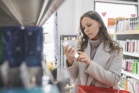 in store aisle, informed beauty shopping, label reading, conscious consumer choice, personal care awareness, retail decision process