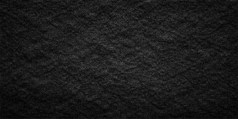 Fototapeta premium A dark textured surface features a detailed black and white fabric pattern and rough black leather material with a macro grunge textile design for a grey cloth backdrop
