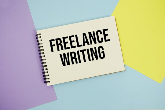 Freelance Writing text written on notepad flat lay on multicolor pastel background