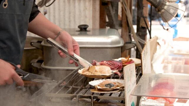 Street Vendor Grilling Fresh Seafood and Squid at Tokyo Market