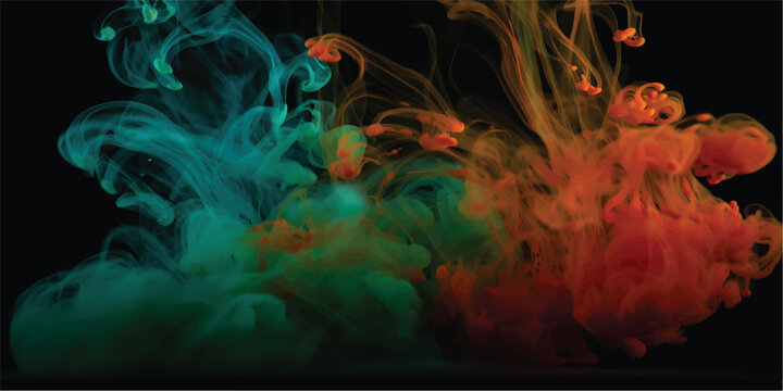 Dramatic abstract shot of orange and turquoise blue colorful liquid ink or particulate clouds colliding and dispersing in water against a pure black background.