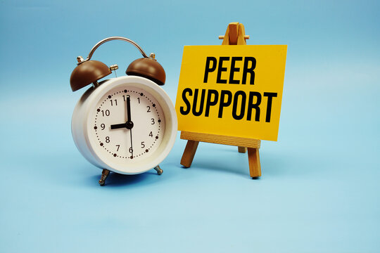 Peer Support text with alarm clock on blue background