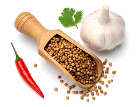 Top view of realistic wooden scoop of coriander seed with one sliced garlic on white background