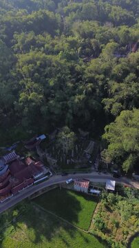 Aerial vertical view of Bori Kalimbuang megalithic site with ancient menhirs and traditional Toraja houses.