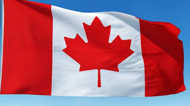 Canadian flag waving in blue sky