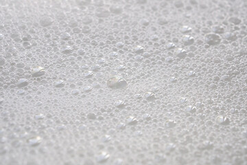 Obraz premium Closeup abstract white soap foam bubbles texture background