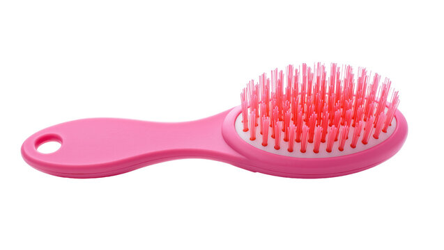 Vibrant pink hairbrush with rounded plastic handle and dense red bristles, isolated on transparent background for beauty product advertising