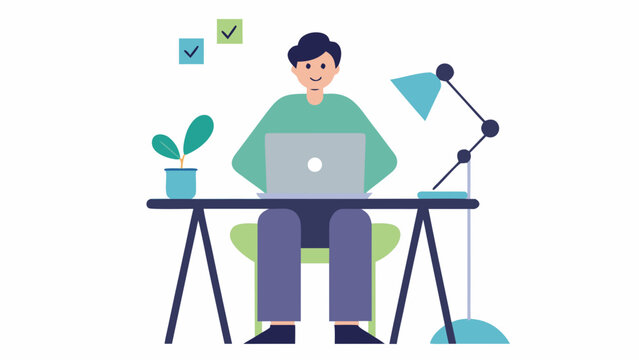 A man sitting at a desk working on a laptop computer