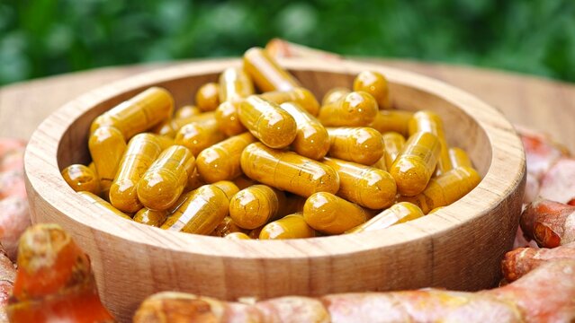 Turmeric curcumin capsules with rhizome (root).