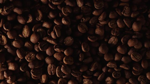 Top down slow motion shot of coffee beans