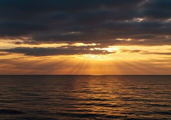 Obraz premium Dramatic warm light spreads across the expansive sea and clouds, meeting the distant calm horizon line, sky, vast, space