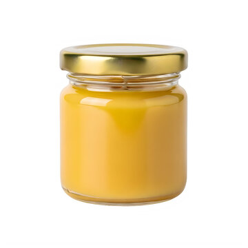 A small jar of honey with a gold lid