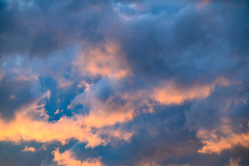 Fototapeta premium Cinematic clouds illuminated by sunset, rich in color and depth