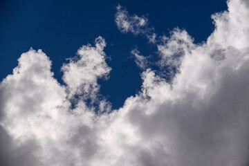 Obraz premium Clouds float in clear sky