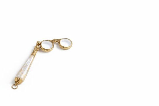 Engraved opera lorgnette with mother of pearl handle isolated on white background