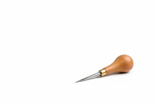 Pearwood drypoint burin with polished steel tip for printmaking isolated on white background