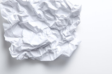 Obraz premium white crumpled paper sheet isolated on a white background, top view.