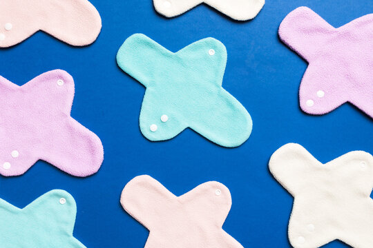 Eco-friendly reusable fabric women's pads. set of colorful bright reusable menstrual pads. zero waste woman periods concept top view with copy space