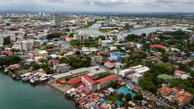 Aerial cityscape drone above Iloilo city Philippines urban landscape with river and skyline Panay Island 