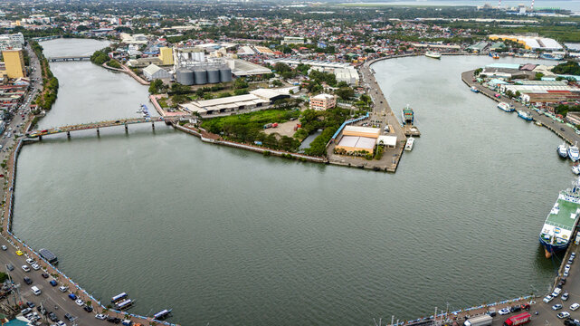Panay Island, Iloilo City Cityscape skyline aerial drone view with river and downtown church 