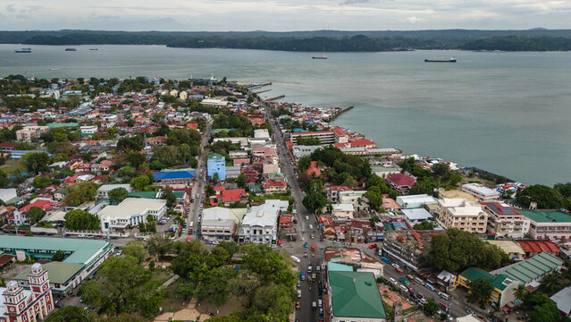 Panay Island, Iloilo City Cityscape skyline aerial drone view with river and downtown church 