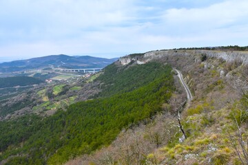 Obraz premium View of landscape at Bržanija with a railroad bellow the cliff and Črni Kal viaduct in Istria, Primorska, Slovenia