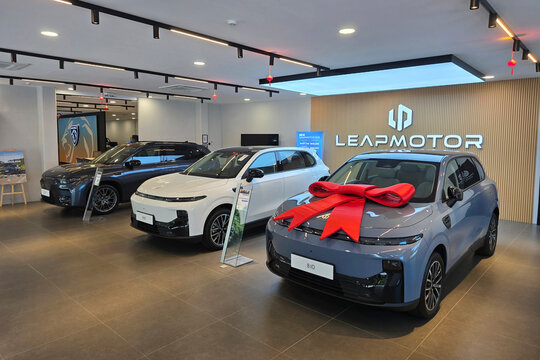 Penang, Malaysia - Feb 20, 2026: A white Leapmotor B10 and a grey Leapmotor C10 electric SUV displayed inside a brightly lit showroom.