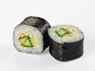 Two cucumber and sesame maki sushi rolls isolated on white background © Andrei Starostin