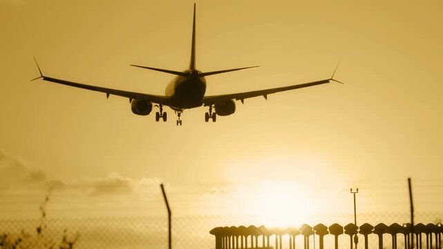 slow motion Airplane flying overhead coming in to land 