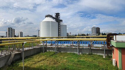 Obraz premium Anaerobic digesters in a municipal wastewater treatment plant, where sludge is decomposed in the absence of oxygen, producing methane (biogas)