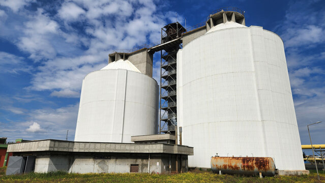 Anaerobic digesters in a municipal wastewater treatment plant, where sludge is decomposed in the absence of oxygen, producing methane (biogas)