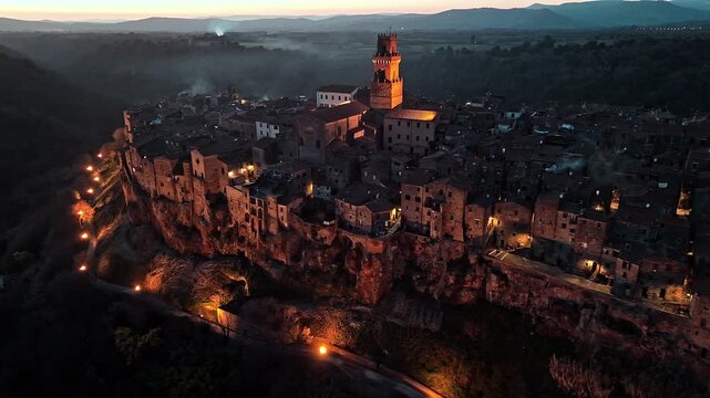 Dusk aerial of charming Pitigliano in Tuscany, evocative medieval ambiance