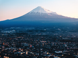 Fototapeta premium Mount Fuji and Fujiyoshida City with Warm Sunrise Light