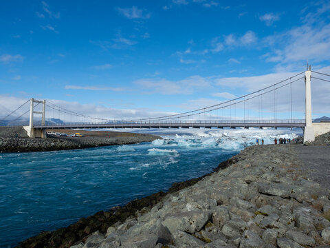 Bridge carrying route 1 over Glacier Lagoon in Iceland with icebergs floating