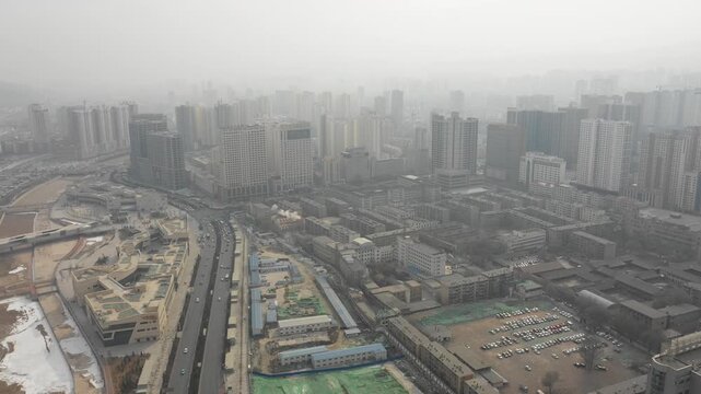 Drone flight of suburbs Xining covered in smog, air pollution in central Chinese city