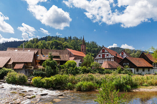 Traditional houses and Kinzig river in Schiltach Black Forest Germany