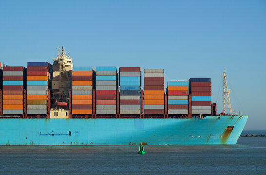 Container ship entering Rotterdam harbour in the Netherlands