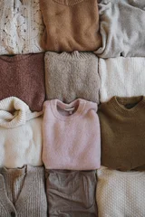 Cozy Winter Apparel Scene With Grid Of Varied Knitted Wool Jumpers and Cardigans © Floral Deco